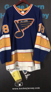 ST.Louis Blues Road Game worn jersey. #18 Ron Wilson. Air Knit CCM Custom Crafted on back hem. Jersey shows excellent to heavy wear with over 12 team repairs. Size 48. Will trade for older San Jose Sharks jerseys.